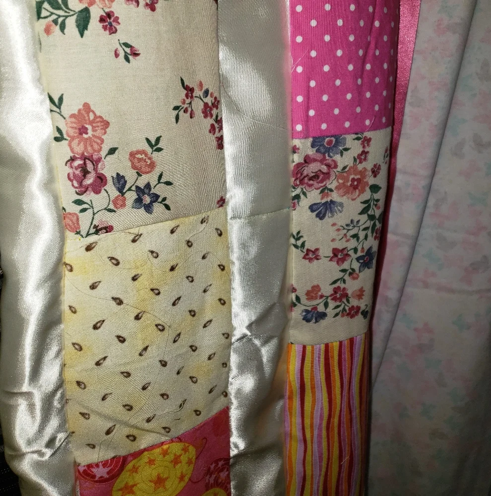 Patchwork Quilt with Pink and Yellow Accents